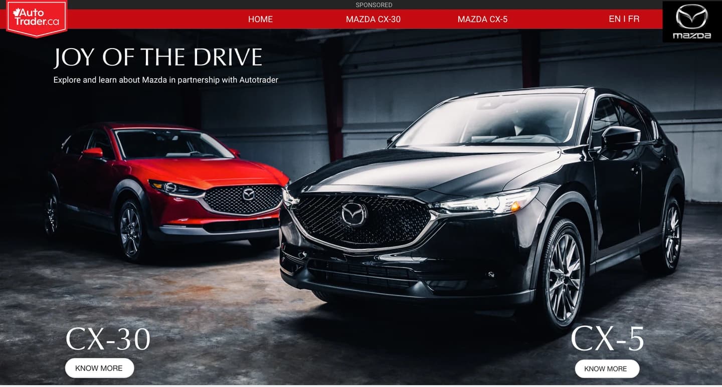 Mazda Joy of the Drive hero with a red CX-30 and a black CX-5 side by side, each with a Know more button.